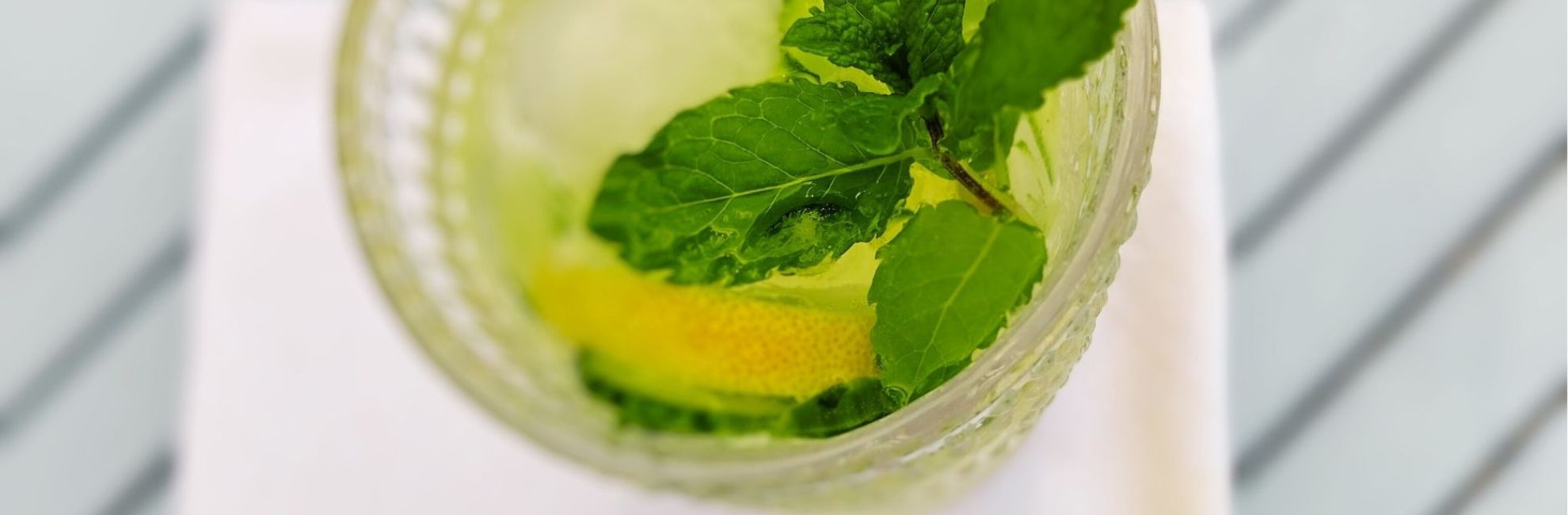 Glass of citron presse with sliced lemon and mint